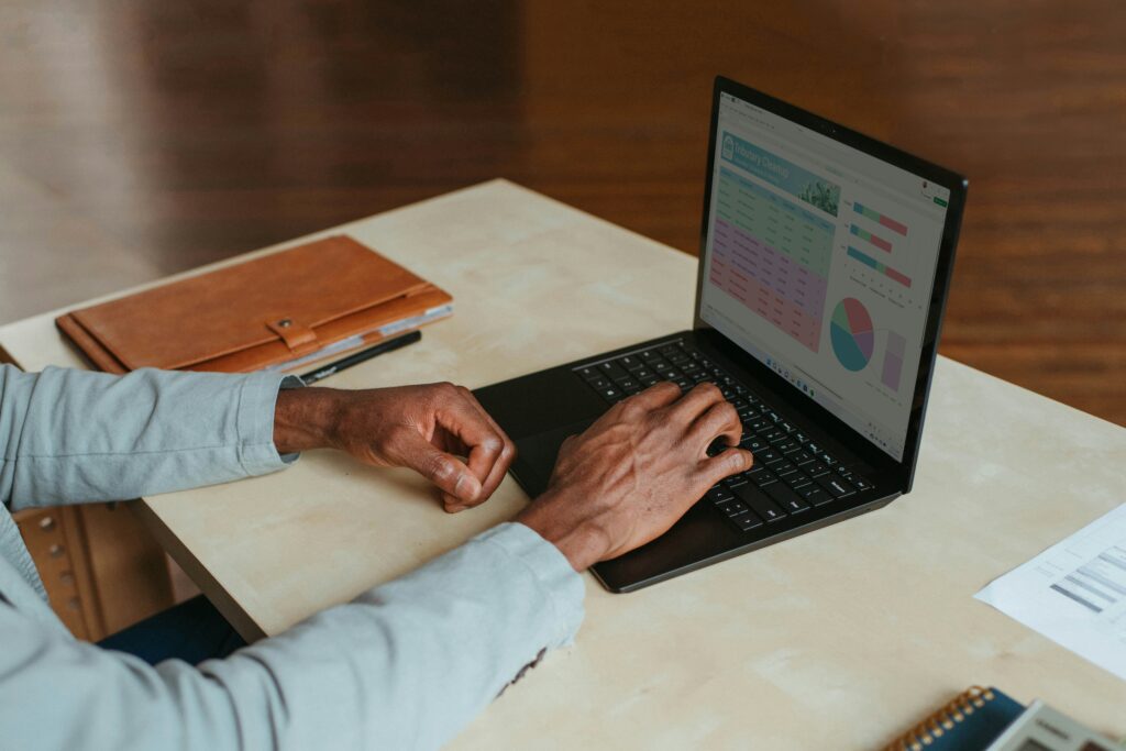 Person reviewing analytics on a laptop.
